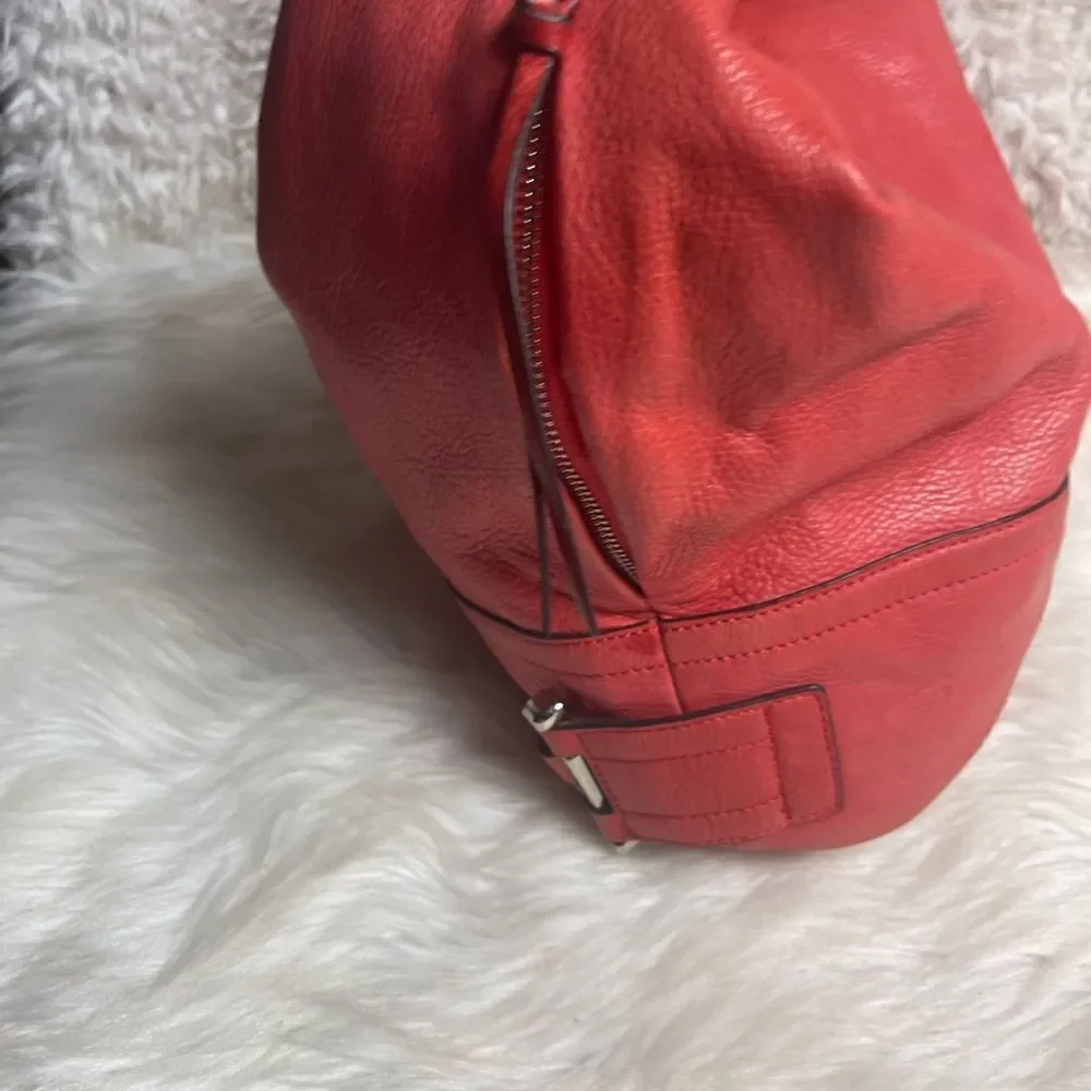 B Makowsky leather orange Hobo bucket style shoulder bag  silver tone hardwares